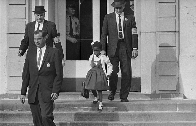 This little girl, Ruby Bridges, had to be escorted by federal deputy marshals for her own safety